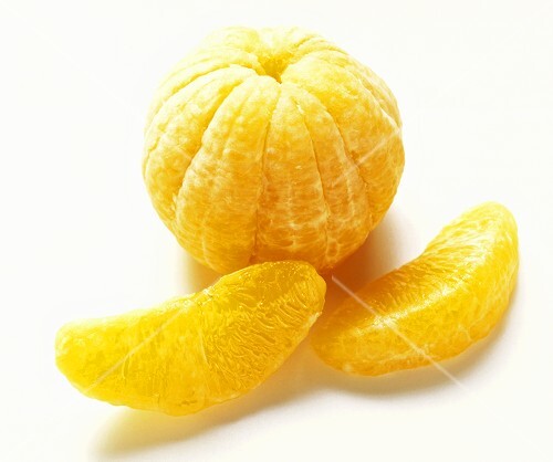 Peeled orange with two wedges of orange