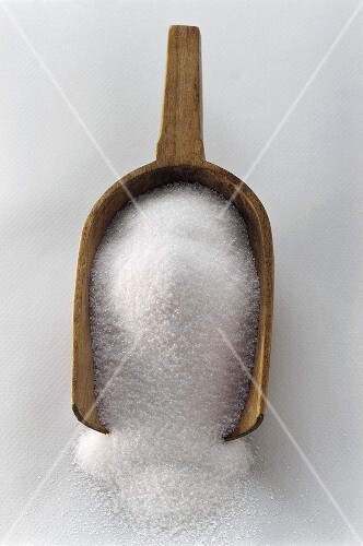 Sugar in a Wooden Scoop