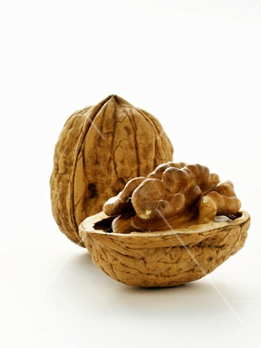 An Opened and a Whole Walnut