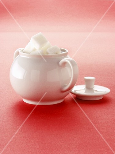 Sugar Cubes in a White Sugar Bowl; Lid