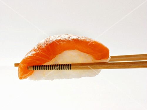 Chopsticks Holding Salmon Sushi