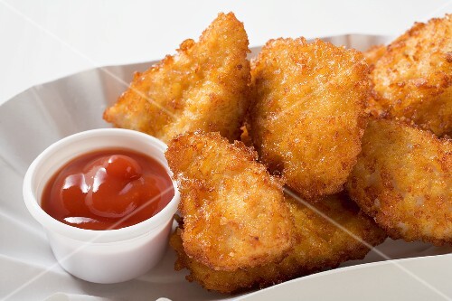 Chicken nuggets with ketchup