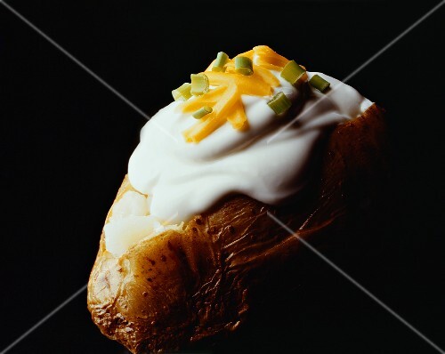 Baked Potato with Sour Cream and Cheddar Cheese