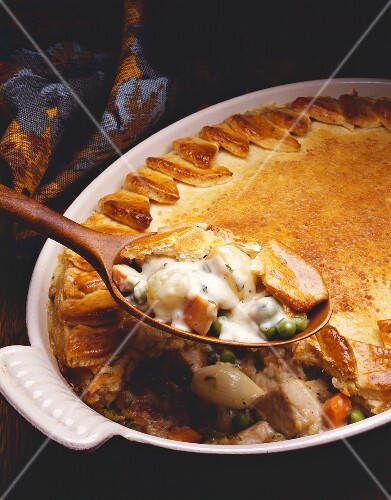 Chicken Pot Pie with Spoonful Above Baking Dish