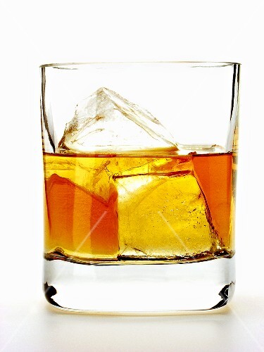 Whiskey with ice cubes in glass (2)