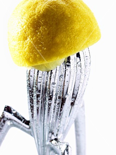 Squeezed lemon on lemon squeezer