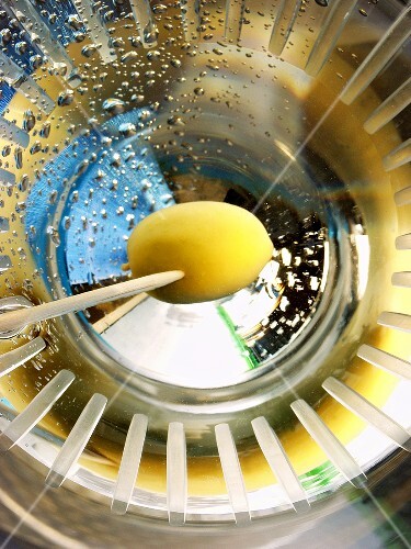 Martini with green olive on toothpick (view from above, 2)