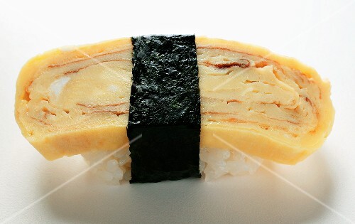 Nigiri sushi with egg and nori
