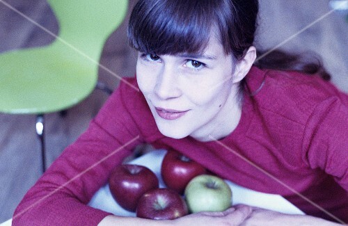 Young woman with apples