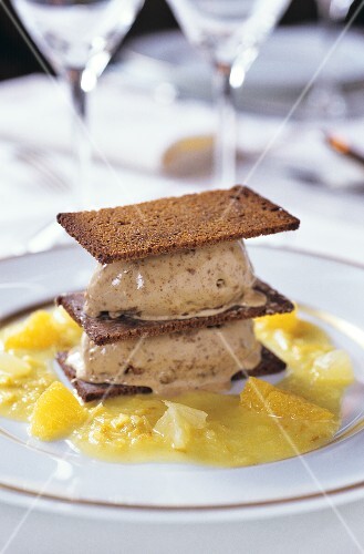 Gingerbread ice cream with black bread and orange sauce
