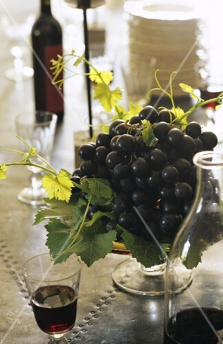 Still life with red wine and red wine grapes