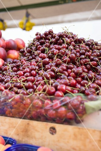 Cherries in a crate at a market