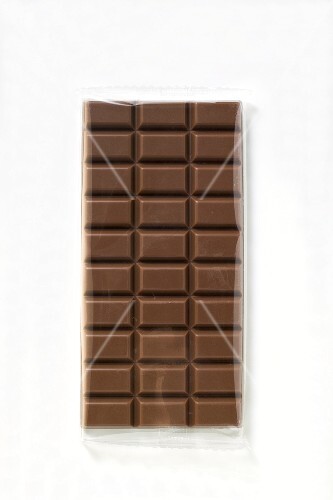 A bar of milk chocolate in cellophane