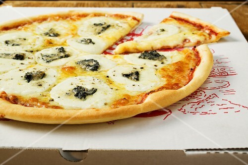 American-style three cheese pizza on pizza box