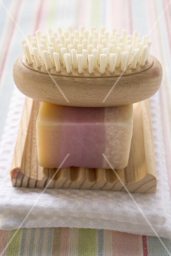 Soap and brush on wooden soap dish