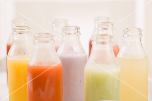 Various different juices in small bottles