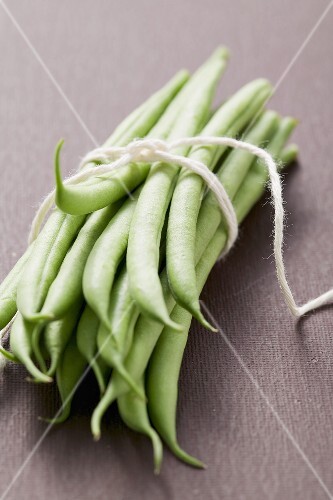 Several green beans, tied in a bundle