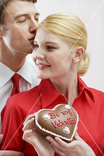 Couple with chocolate heart on Valentine's Day