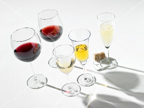 Various wines in glasses, one glass of sparkling wine