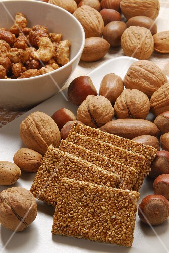Sesame brittle, candied cashew nuts & peanuts beside nuts