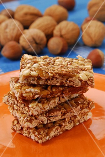 A few bars of nut brittle on orange plate
