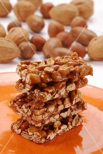 A few peanut bars on orange plate