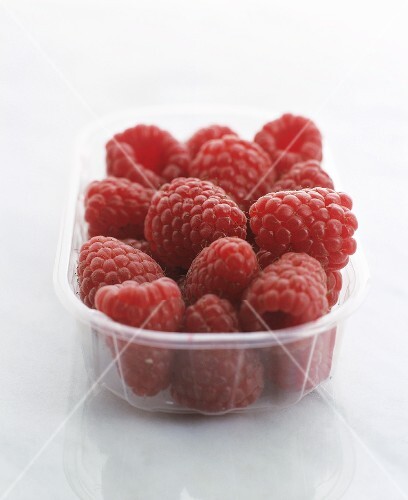 Fresh raspberries in plastic punnet