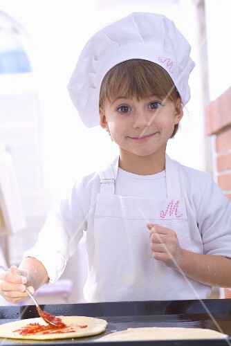 Girl making pizza