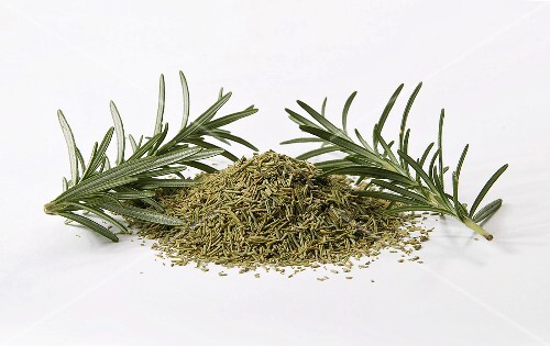 Dried rosemary with fresh sprigs of rosemary