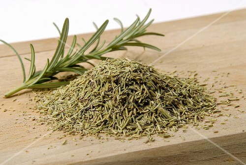 Dried rosemary with fresh sprigs of rosemary