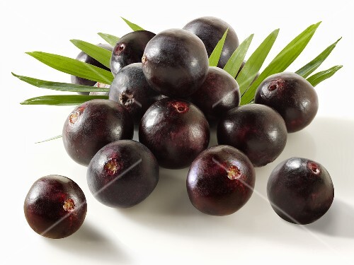 Acai berries with leaves