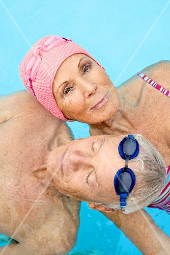 Germany, Senior couple in swimming pool
