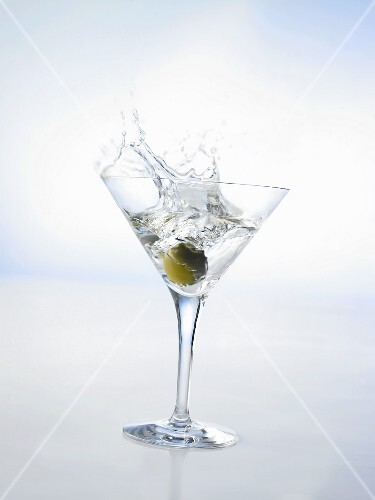 Martini with green olive (splash)