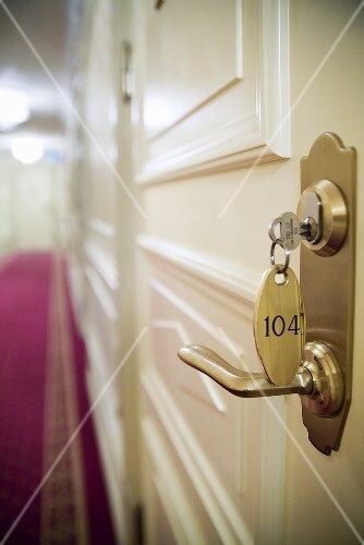 Key in door of hotel room