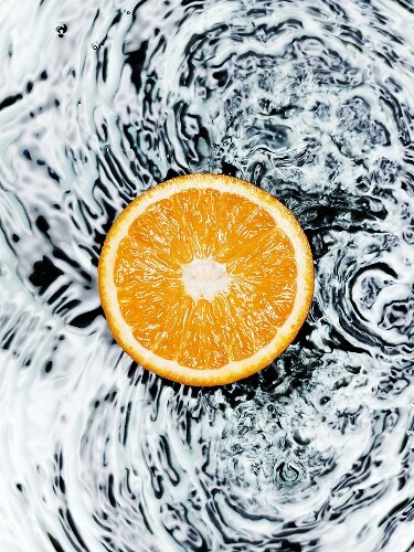 Half an orange on water