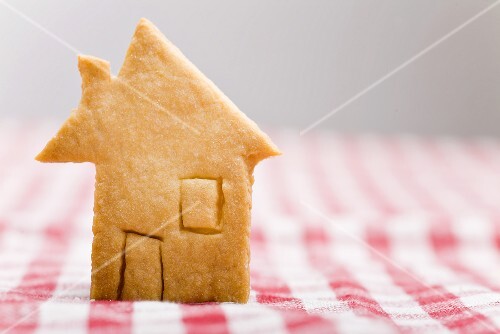 Pastry house on checked tablecloth
