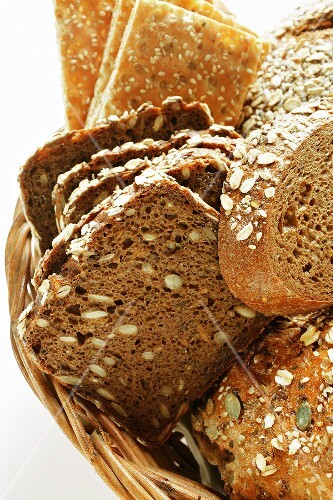 Various types of wholemeal bread & crispbread in bread basket