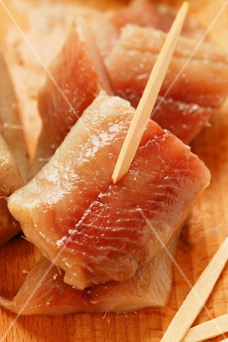 Matje herrings, cut into pieces, on cocktail sticks