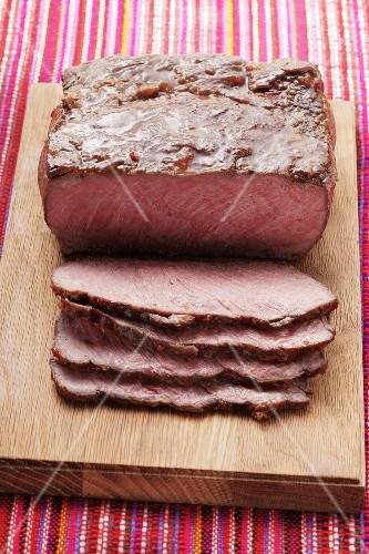 Roast beef on chopping board