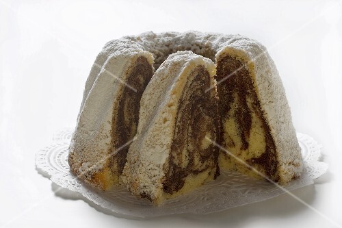 Marbled gugelhupf with icing sugar, a piece cut