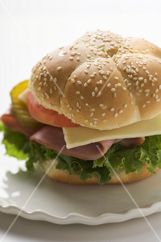 Ham, cheese, tomato and gherkin in sesame roll