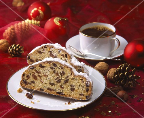 Two slices of stollen and cup of coffee; Christmas decoration