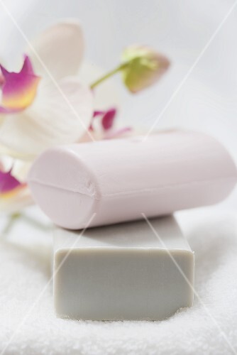 Two soaps on a bath towel
