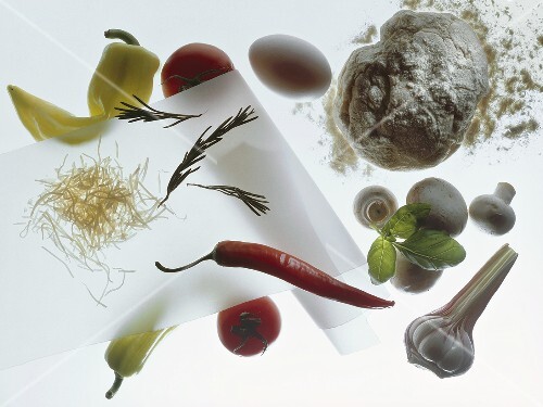 Pizza ingredients (dough, vegetables and grated cheese)