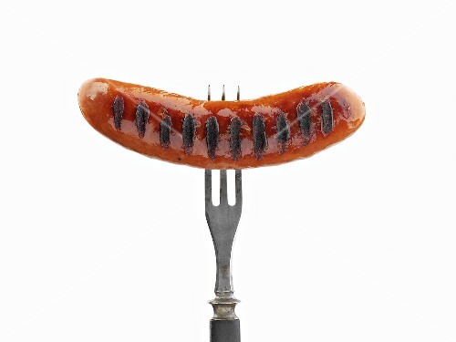 Grilled sausage on fork