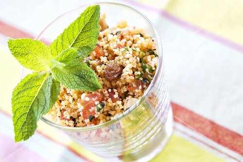 Couscous tabbouleh with vegetables, raisins and mint