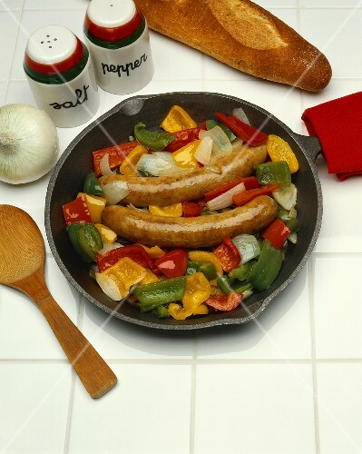 Sausages with Onion and Peppers in a Cast Iron Skillet