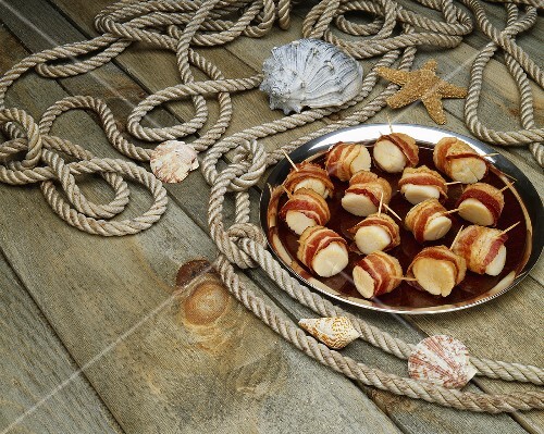Platter of Bacon Wrapped Scallops; On Dock with Rope and Shells