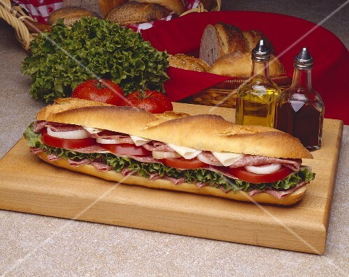 Salami and Provolone Submarine Sandwich on a Cutting Board