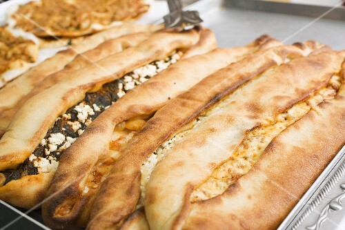 Turkish pizzas with spinach and sheep's cheese fillings